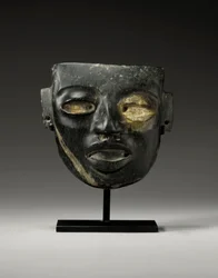 A Teotihuacan stone mask, carved with the youthful face of a dignitary, c.450-650