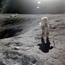 Charles M. Duke, Jr., lunar module pilot of the Apollo 16 mission, collecting lunar samples at the rim of Plum Crater, April 1972