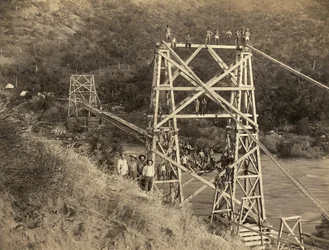 Fresno, California: 1890 This photograph by C.C. Curtis shows the Smith and Moore bridge over the Kings River which is part of flume built by Hiram T. Smith and Austin D. Moore, to transport lumber from the Sierras for their company, the Kings River Lumber