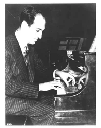 George Gershwin, American composer, at the piano