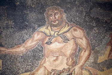 Polypheme Hall. Detail of the cyclope devouring the entrails of a goat. 3rd - 4th century. Roman Villa of the Casale, Sicilia. UNESCO site.