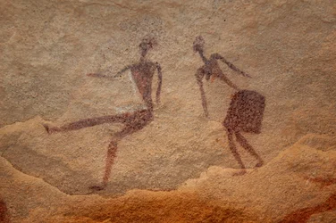 Rock art, Prehistory: Detail of a rock painting of two characters in an ornate shelter, in the Uweinat massif, Egypt