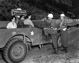 Second World War: Near Monaco French Riviera 30 June 1945: Two Wacs on leave and guests of the US Riviera Recreational Area (USRRA) discuss with two US Army military police officers stationed at the edge of the Mone