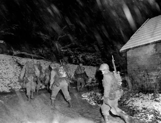 Second World War: Region of Langefosse (Vosges) November 1944: Infantrymen of 142nd RI of the 36th DI of the 7th US Army return from the lines under a snowstorm