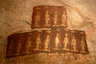 Theravada Buddhism; ancient wall painting; standing Buddha Shakyamuni; Mudra; Varada; gesture of wish-granting; Tham Pa cave; at Nong Thang; Xieng Khouang province; Laos; Southeast Asia; Asia