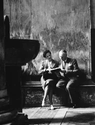 Two People Sitting in a Church
