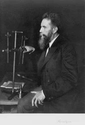 Wilhelm Conrad Roentgen, German physicist, at his workbench