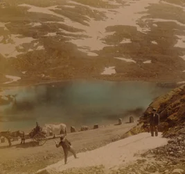 Travellers with July snowballs, on road over the Haukeli mountains, Norway