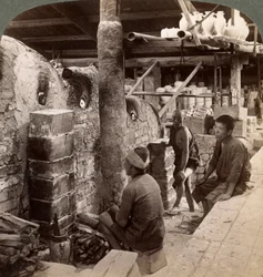 Workmen watching kilns full of Awata porcelain, Kinkosan works, Kyoto, Japan, 1904