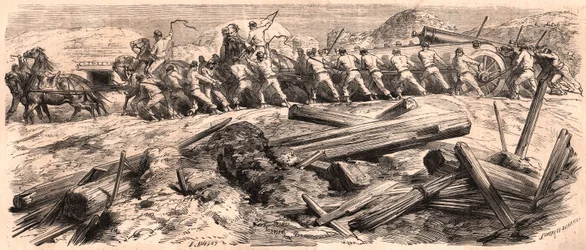 Amid the ruins, a team of six horses towing a heavy artillery piece, a group of soldiers accompanied the gun while two others lead the horses with a whip