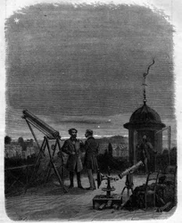 Astronomers observing with their astronomical glasses the planet Mercury in the sky of Paris, February 17