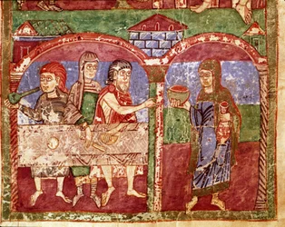 Episode of the life of Saint Radegonde (Radegundis) of Poitiers (519-587), wife of Clotaire I, king of the Franks: Radegonde during her charity works serves at the table of the poor. Miniature from an 11th century manuscript