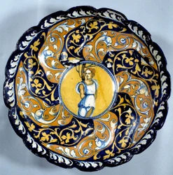 Godronnee Faience Cup Decorated with an Angel