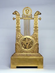Harp shaped fireplace clock.