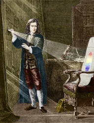 The English physicist Isaac Newton (1642-1727) decomposing light with a prism of glass. Engraving from 1880