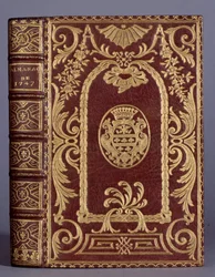 Book cover, binding with ornaments varies to the arms of the Cotte family of an almanac from 1747