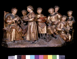 Teacher and students - carved wood