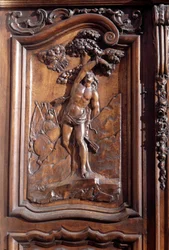 The martyrdom of Saint Sebastian, (detail) of the carved wooden door of the church of the immaculate conception, Menton