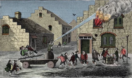 Use of a fire pump to extinguish a fire. 1733 engraving.