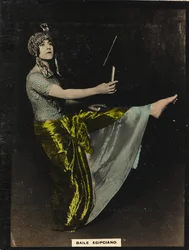 A young woman in oriental costumes performing an Egyptian dance