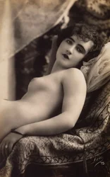 A Young Woman Posing Nude on a Couch