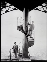 Gustave Eiffel and his son-in-law Adolphe Salles on the staircase of the Eiffel Tower, Paris