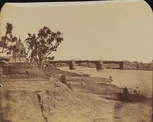Iron bridge with stone piers, with civilians in the foreground, Gumti River, Lucknow