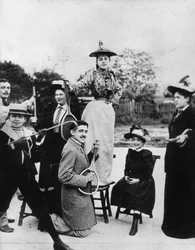 Marcel Proust Kneeling with a Tennis Racket in Front of Jeanne Ponquet Standing on a Chair in Neuilly, 1892