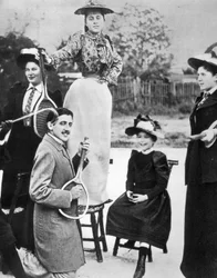 Marcel Proust, in the Midst of a Group of Young Women, Playing Guitar on a Tennis Racket at Bineau Boulevard in Paris