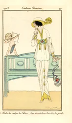 Woman in crepe-de-chine gown with belt and bag embroidered with pearls. A cupid aims a love dart at her head