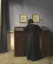 Ida Standing at a Desk