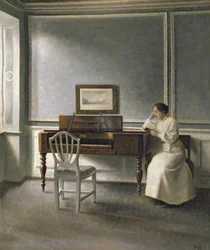 Woman Reading by a Piano