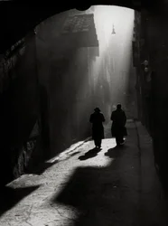 Two Men Walk on a Typical Little Street in Florence
