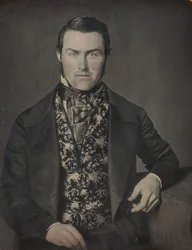 Seated Man in Floral Vest