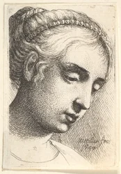 Woman with string of pearls in her hair looking downwards to right