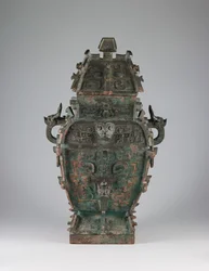 Covered wine vessel with zoomorphic masks and animal-headed handles