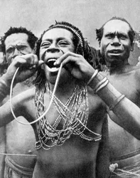 Swallowing canes in a ceremonial ritual, New Guinea