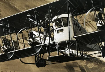 Two crewmen amid the wires and struts of an Ilia Mourometz II bomber putting out an engine fire