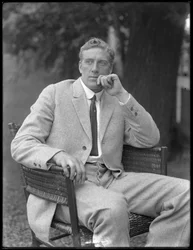English Boxer William Thomas Wells (Bombardier Billy Wells), Posed Seated in a Tweed Suit