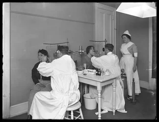 Two patients being examined, Examining room #1, Seton Hospital, Spuyten Duyvil, Bronx