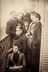 The Claudel Family, Jessie Lipscomb, Ferdinand de Massary and His Father on the Balcony of the Apartment of 31 Boulevard de Port Royal. (In the Foreground: Louise (b. 1866), Behind Her, Madame Claudel (b. Louise Athanaise Brains in 1840) and Camille (1864-