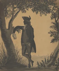 Young Man Leaning Against a Tree With a Book